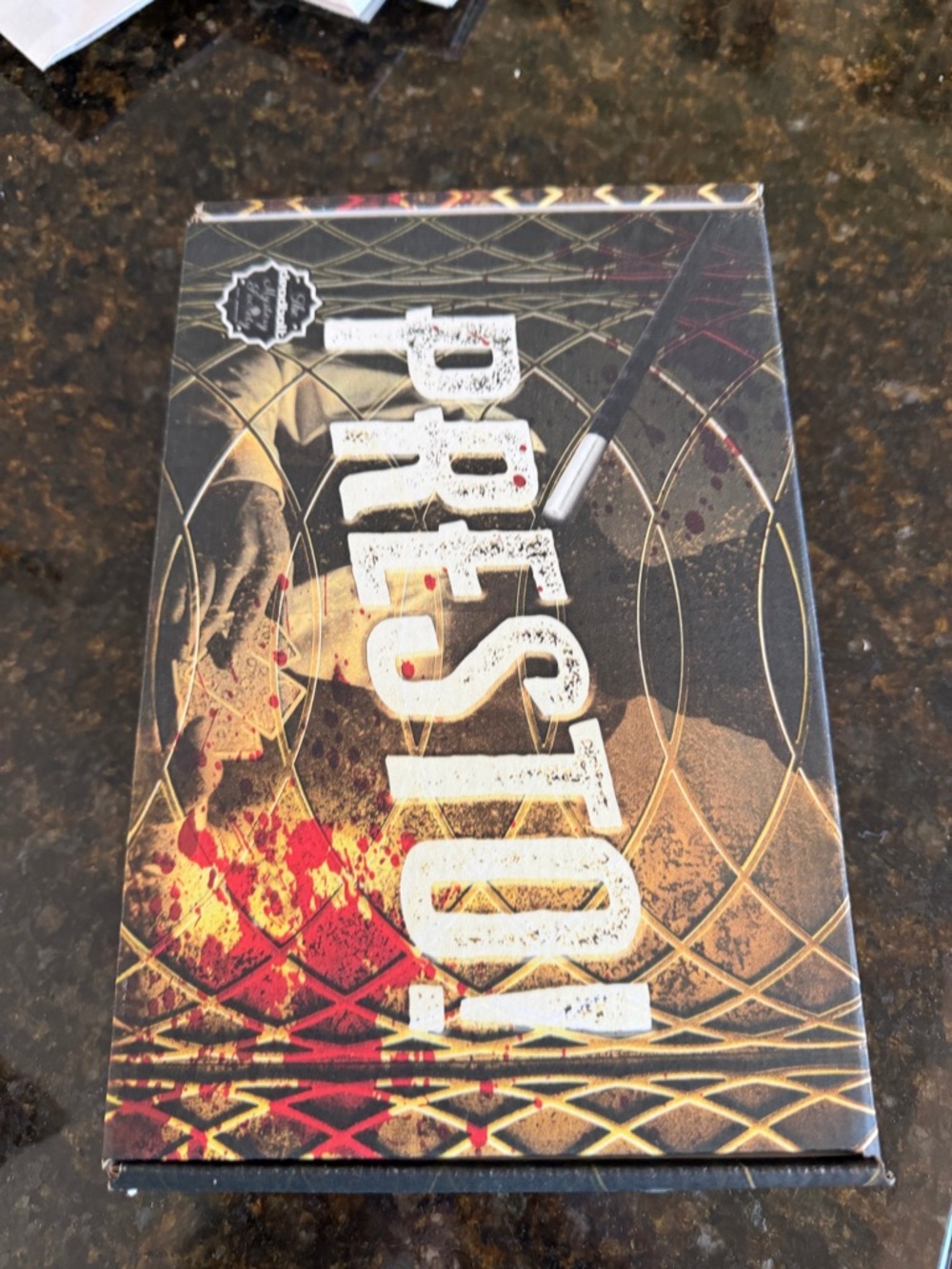 The Deadbolt Society mystery game in a box.  Solve the game !